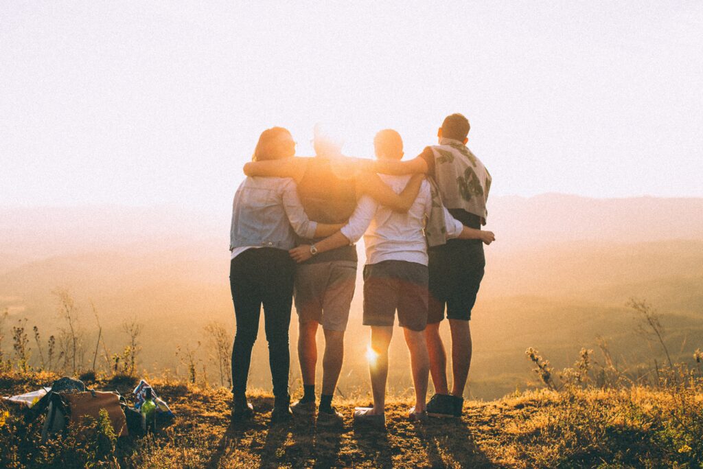 group hug in sunset